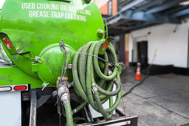 a grease trap pumping truck at a restaurant in Bell Gardens